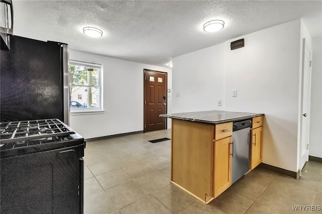 1335 James Ave, Niagara Falls, NY 14305 - kitchen featuring gas stove, stainless steel dishwasher, freestanding refrigerator, a textured ceiling, and dark countertops