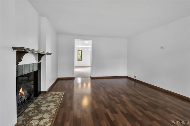 1335 James Ave, Niagara Falls, NY 14305 - unfurnished living room featuring wood finished floors and a lit fireplace