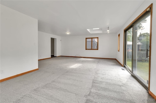 1335 James Ave, Niagara Falls, NY 14305 - empty room with carpet flooring and a skylight