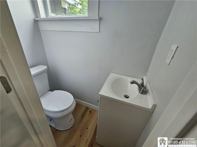 901 W Henley St, Olean, NY 14760 - half bath featuring vanity and wood finished floors
