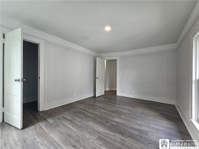 901 W Henley St, Olean, NY 14760 - unfurnished bedroom with wood finished floors and baseboards