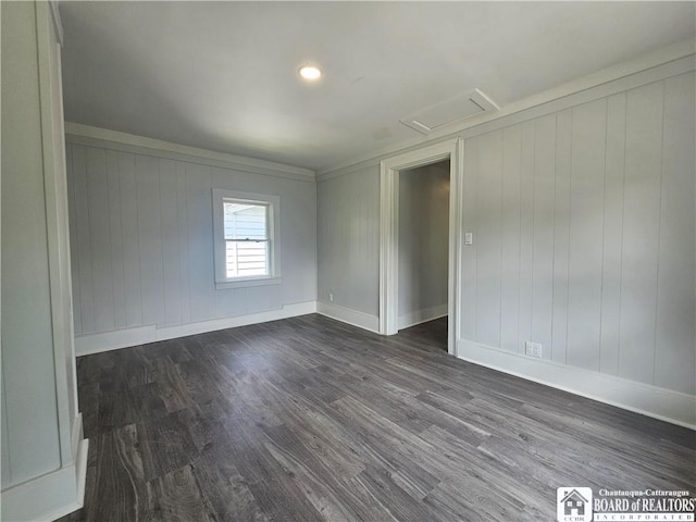 901 W Henley St, Olean, NY 14760 - spare room featuring attic access and dark wood-type flooring