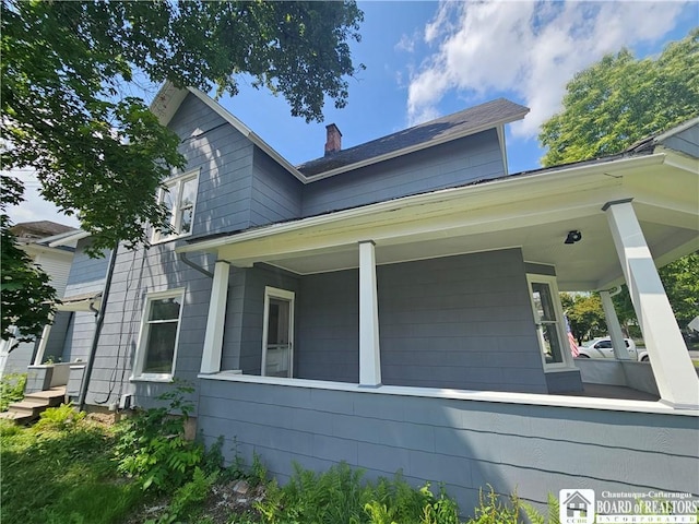 901 W Henley St, Olean, NY 14760 - view of side of property with a porch and a chimney