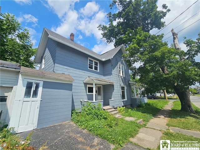 901 W Henley St, Olean, NY 14760 - traditional-style house featuring a chimney and a shingled roof