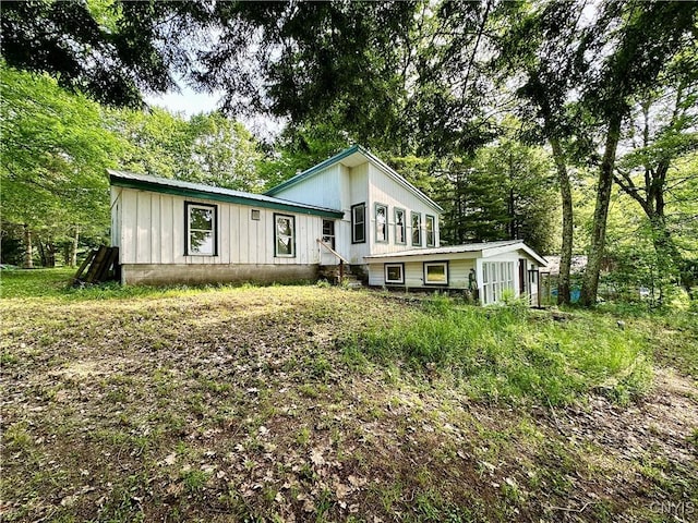 352 Sloperville Rd, Albion, NY 13302 - view of front facade with board and batten siding