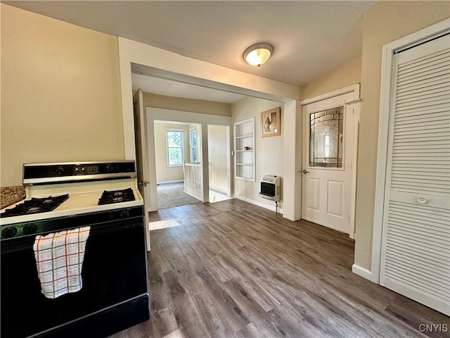 352 Sloperville Rd, Albion, NY 13302 - kitchen featuring gas range, heating unit, and dark wood-type flooring