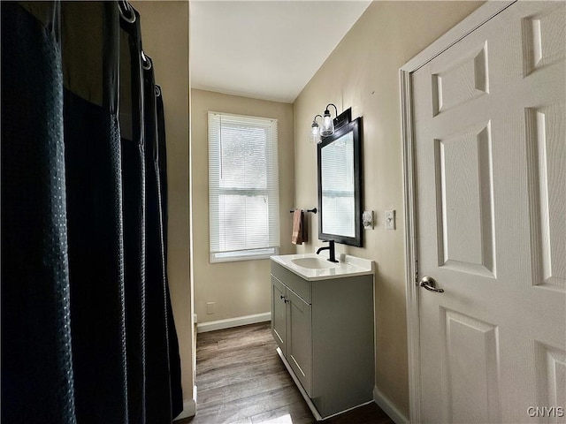352 Sloperville Rd, Albion, NY 13302 - full bath with vanity, wood finished floors, and a shower with shower curtain