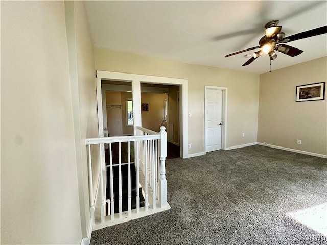 352 Sloperville Rd, Albion, NY 13302 - empty room featuring dark carpet and ceiling fan
