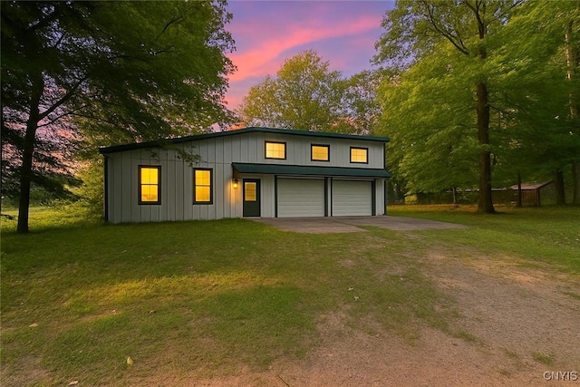 352 Sloperville Rd, Albion, NY 13302 - view of front of house with driveway, a front yard, a garage, and board and batten siding