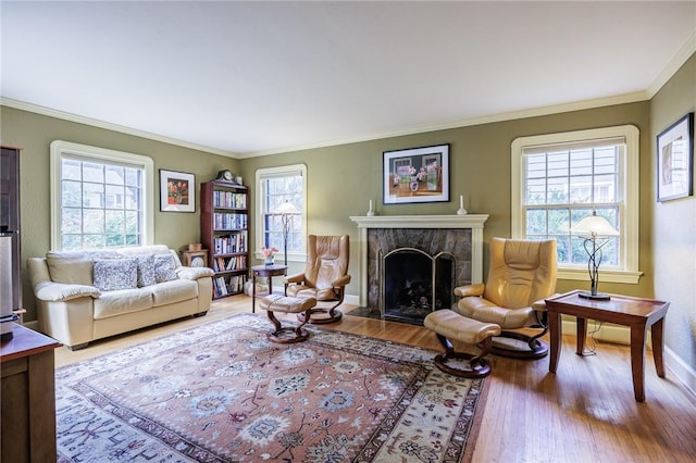 54 Covington Rd, Irondequoit, NY 14617 - living room featuring wood finished floors, crown molding, and a fireplace