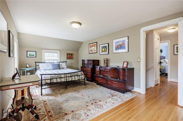 54 Covington Rd, Irondequoit, NY 14617 - bedroom with light wood-style floors and vaulted ceiling
