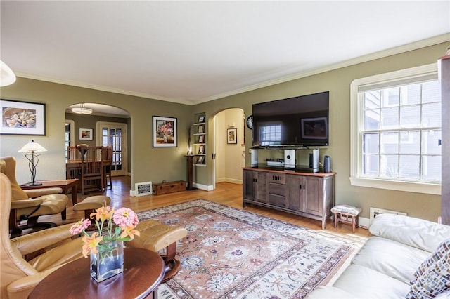 54 Covington Rd, Irondequoit, NY 14617 - living room with arched walkways, light wood-type flooring, and crown molding