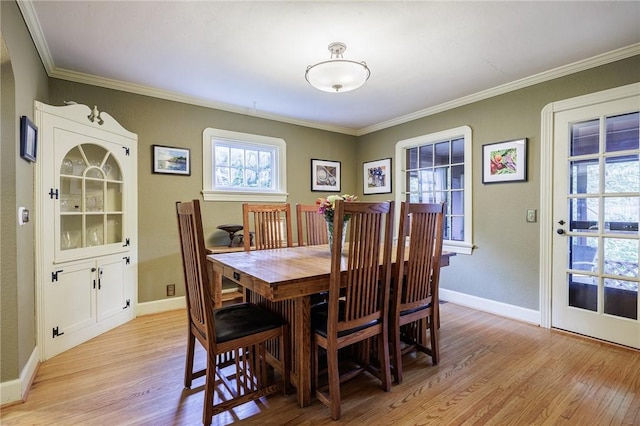 54 Covington Rd, Irondequoit, NY 14617 - dining area with light wood finished floors and ornamental molding