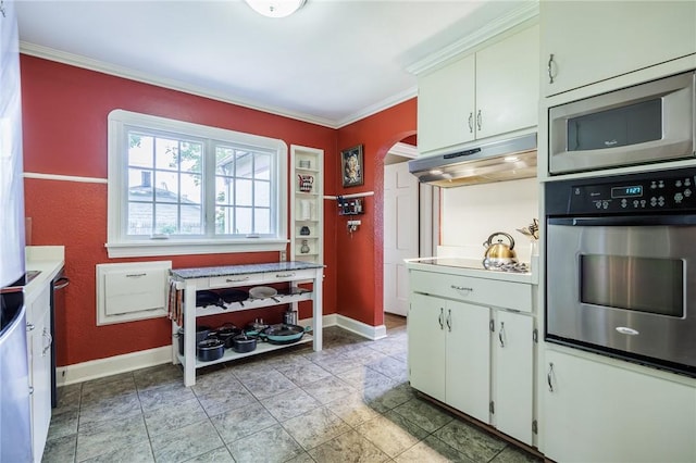 54 Covington Rd, Irondequoit, NY 14617 - kitchen featuring appliances with stainless steel finishes, under cabinet range hood, arched walkways, crown molding, and light countertops
