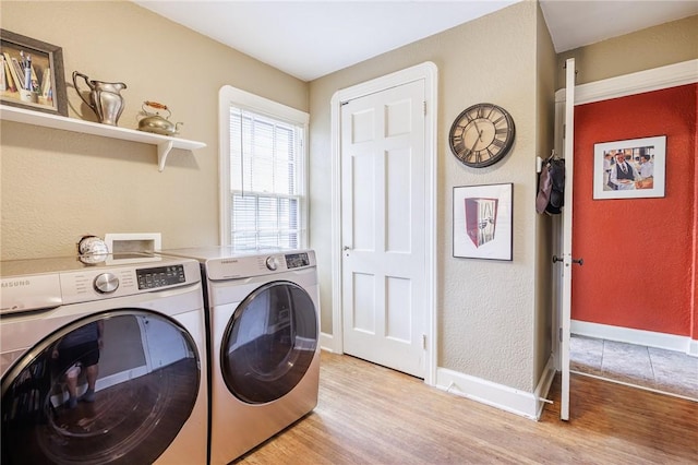 54 Covington Rd, Irondequoit, NY 14617 - laundry area with washer and dryer, light wood-style floors, and a textured wall