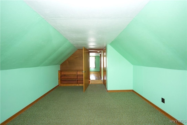 6167 N Whitham Dr, Niagara, NY 14304 - additional living space with lofted ceiling and carpet
