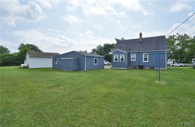 6167 N Whitham Dr, Niagara, NY 14304 - back of house featuring a lawn and a chimney