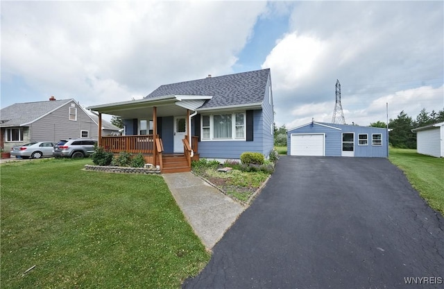 6167 N Whitham Dr, Niagara, NY 14304 - bungalow featuring covered porch, a garage, an outbuilding, a front lawn, and asphalt driveway