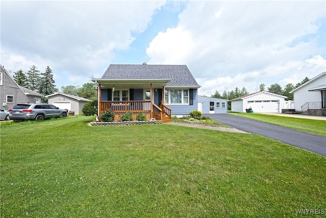 6167 N Whitham Dr, Niagara, NY 14304 - bungalow-style home with covered porch, a detached garage, an outdoor structure, a front lawn, and a shingled roof