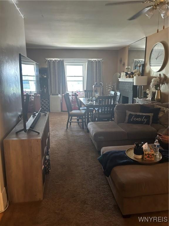 50 Hubbell Ave, Buffalo, NY 14220 - carpeted living area featuring ceiling fan and a fireplace