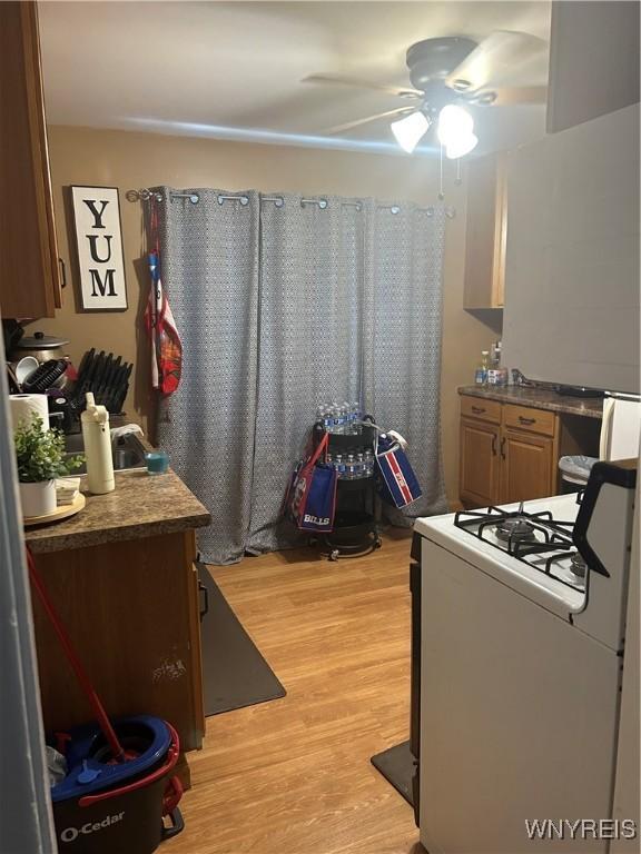 50 Hubbell Ave, Buffalo, NY 14220 - kitchen featuring gas range gas stove, ceiling fan, and light wood-style flooring