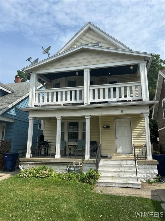 50 Hubbell Ave, Buffalo, NY 14220 - rear view of house featuring a balcony, a porch, and a yard