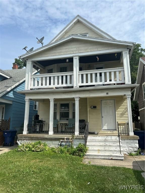 50 Hubbell Ave, Buffalo, NY 14220 - rear view of property with a balcony, a porch, and a yard