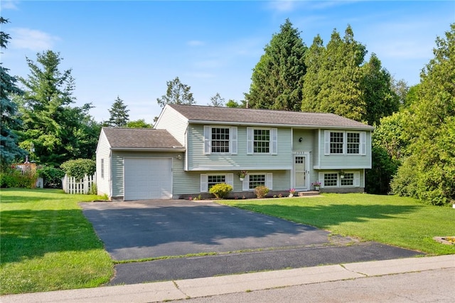 1535 Bluestem Ct, Walworth, NY 14568 - split foyer home with an attached garage, driveway, and a front yard