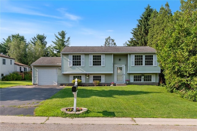 1535 Bluestem Ct, Walworth, NY 14568 - raised ranch featuring asphalt driveway, a front lawn, and an attached garage