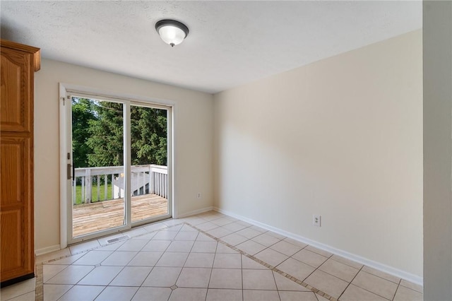1535 Bluestem Ct, Walworth, NY 14568 - unfurnished room with light tile patterned floors and baseboards