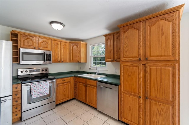 1535 Bluestem Ct, Walworth, NY 14568 - kitchen with stainless steel appliances, dark countertops, open shelves, light tile patterned flooring, and brown cabinets