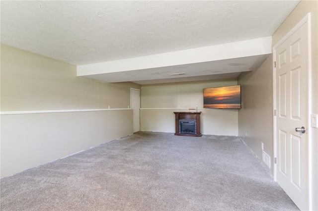 1535 Bluestem Ct, Walworth, NY 14568 - unfurnished living room with carpet flooring, a textured ceiling, and a fireplace