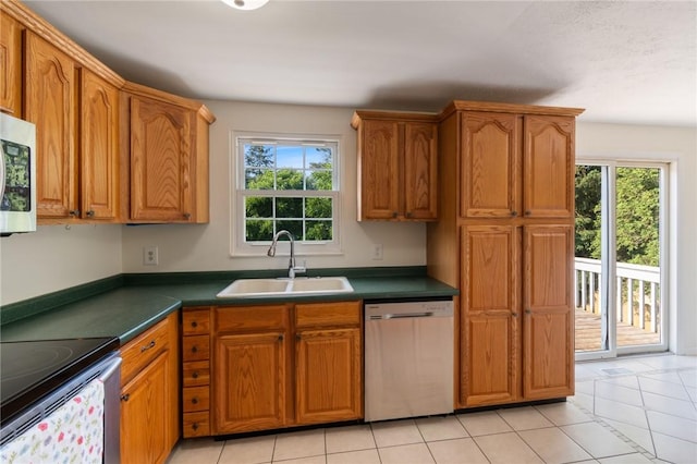 1535 Bluestem Ct, Walworth, NY 14568 - kitchen with appliances with stainless steel finishes, healthy amount of natural light, and brown cabinets