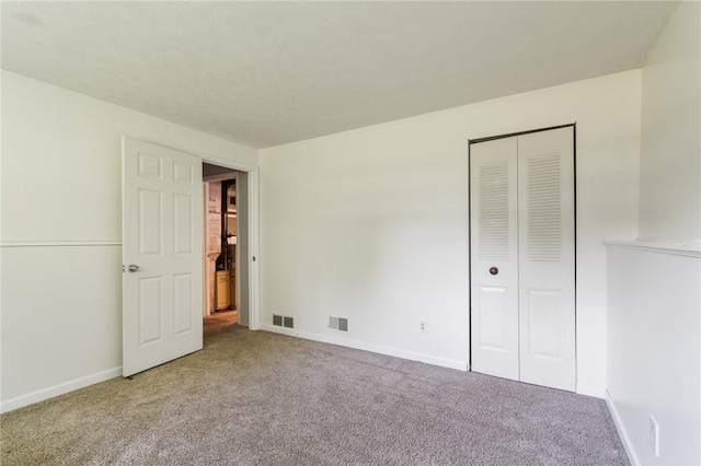 1535 Bluestem Ct, Walworth, NY 14568 - unfurnished bedroom featuring carpet floors and a closet