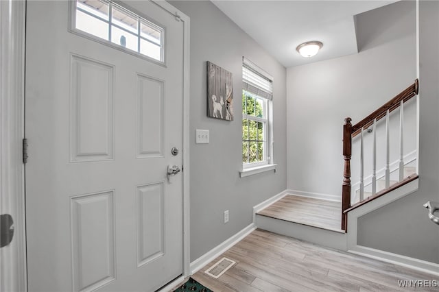 5 Scooter Ln, Hamburg, NY 14075 - entrance foyer with stairs and light wood-type flooring