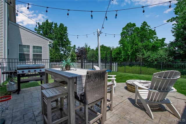 5 Scooter Ln, Hamburg, NY 14075 - fenced backyard featuring outdoor dining space, a patio area, and a grill