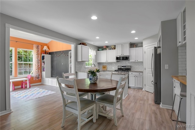 5 Scooter Ln, Hamburg, NY 14075 - dining room featuring light wood finished floors and recessed lighting