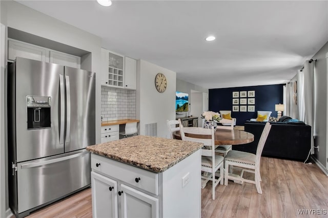 5 Scooter Ln, Hamburg, NY 14075 - kitchen with stainless steel fridge with ice dispenser, light wood-type flooring, white cabinetry, glass insert cabinets, and recessed lighting