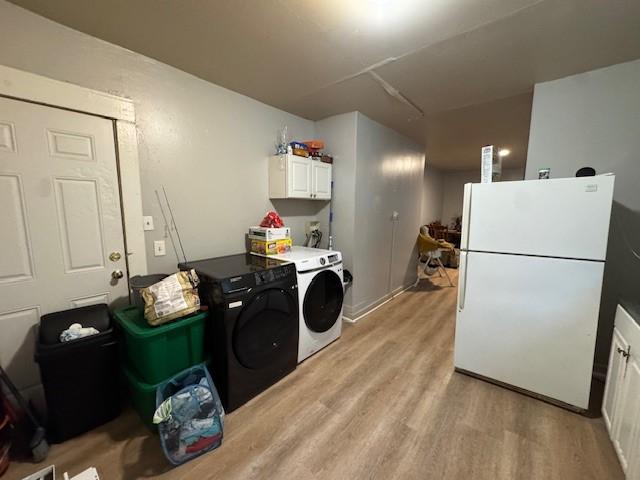 355 Champlain St Unit 353, Rochester, NY 14611 - washroom with cabinet space, separate washer and dryer, and light wood-type flooring
