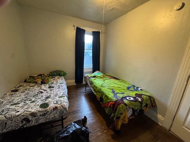 355 Champlain St Unit 353, Rochester, NY 14611 - bedroom featuring a textured ceiling and dark wood finished floors