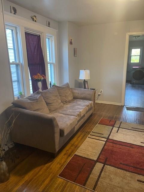 355 Champlain St Unit 353, Rochester, NY 14611 - living room with wood finished floors and baseboards