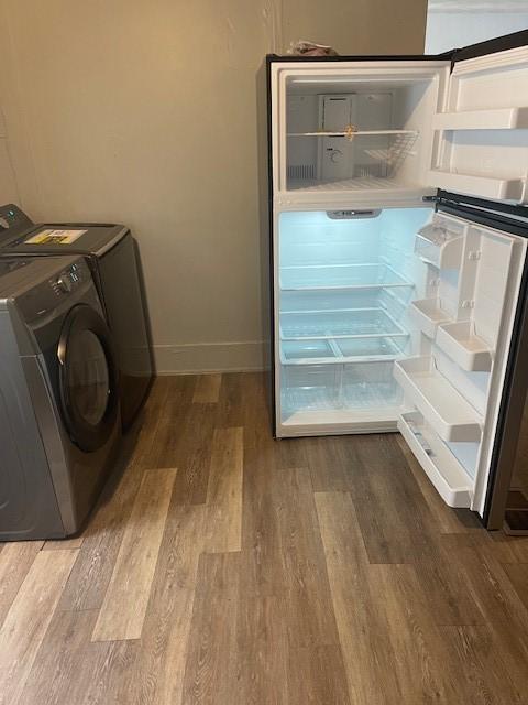 355 Champlain St Unit 353, Rochester, NY 14611 - laundry room with wood finished floors and washer and dryer