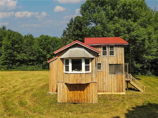 672 Backus Rd, New Lisbon, NY 13415 - view of outdoor structure with stairway and a wooded view