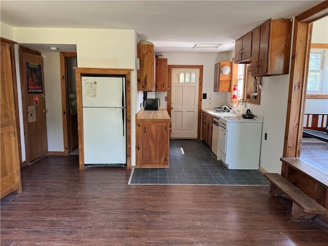 672 Backus Rd, New Lisbon, NY 13415 - kitchen featuring freestanding refrigerator, light countertops, dark wood finished floors, and brown cabinetry