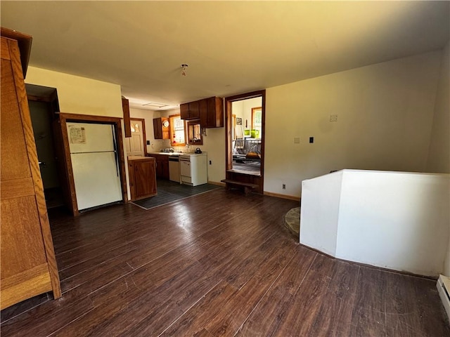 672 Backus Rd, New Lisbon, NY 13415 - kitchen featuring freestanding refrigerator, light countertops, dark wood-type flooring, stainless steel dishwasher, and a baseboard heating unit