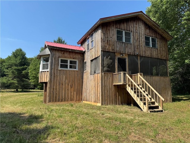 672 Backus Rd, New Lisbon, NY 13415 - view of side of home featuring a lawn, a metal roof, and stairs