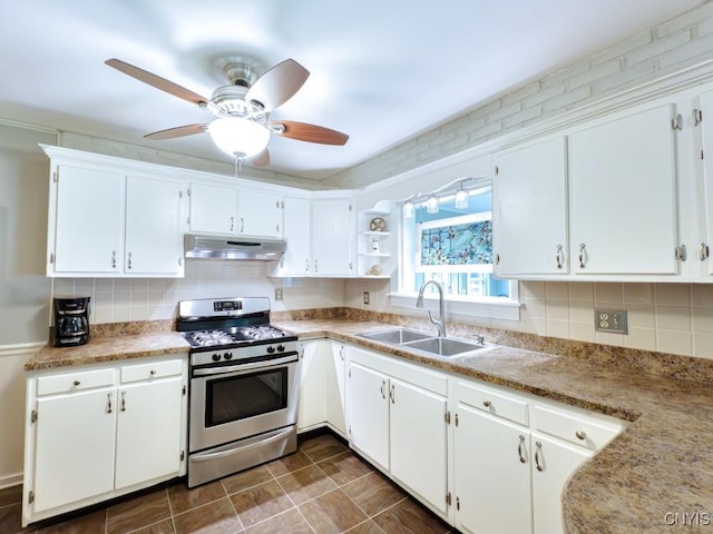 9242 Sixty Rd, Lysander, NY 13135 - kitchen featuring stainless steel range with gas stovetop, under cabinet range hood, white cabinetry, and a ceiling fan