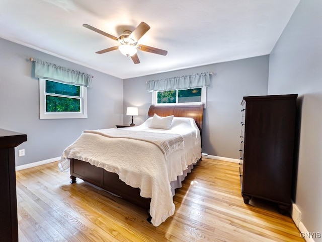 9242 Sixty Rd, Lysander, NY 13135 - bedroom with light wood finished floors and ceiling fan