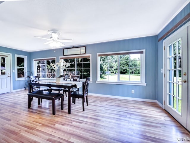 9242 Sixty Rd, Lysander, NY 13135 - dining area with healthy amount of natural light, wood finished floors, ceiling fan, crown molding, and french doors