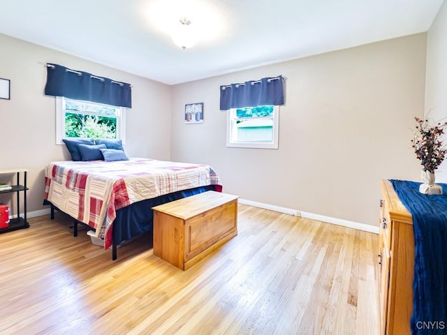 9242 Sixty Rd, Lysander, NY 13135 - bedroom featuring multiple windows and light wood finished floors